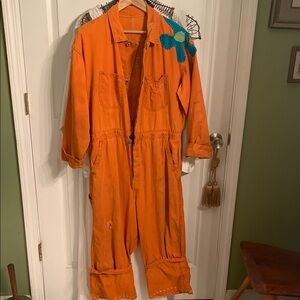 Orange Jumpsuit with Blue Flower Patch